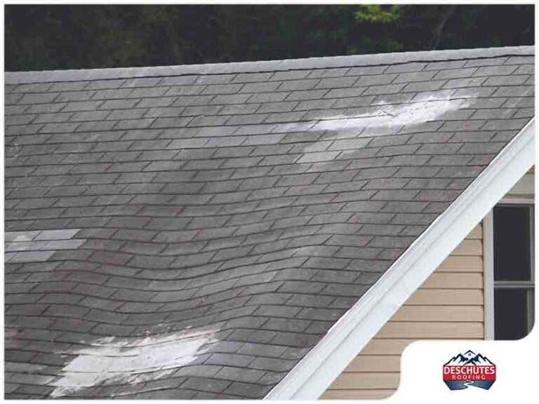 Sagging and uneven residential roof showing deterioration