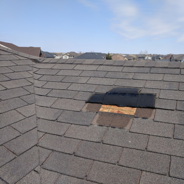Missing roof shingles exposing the roof deck