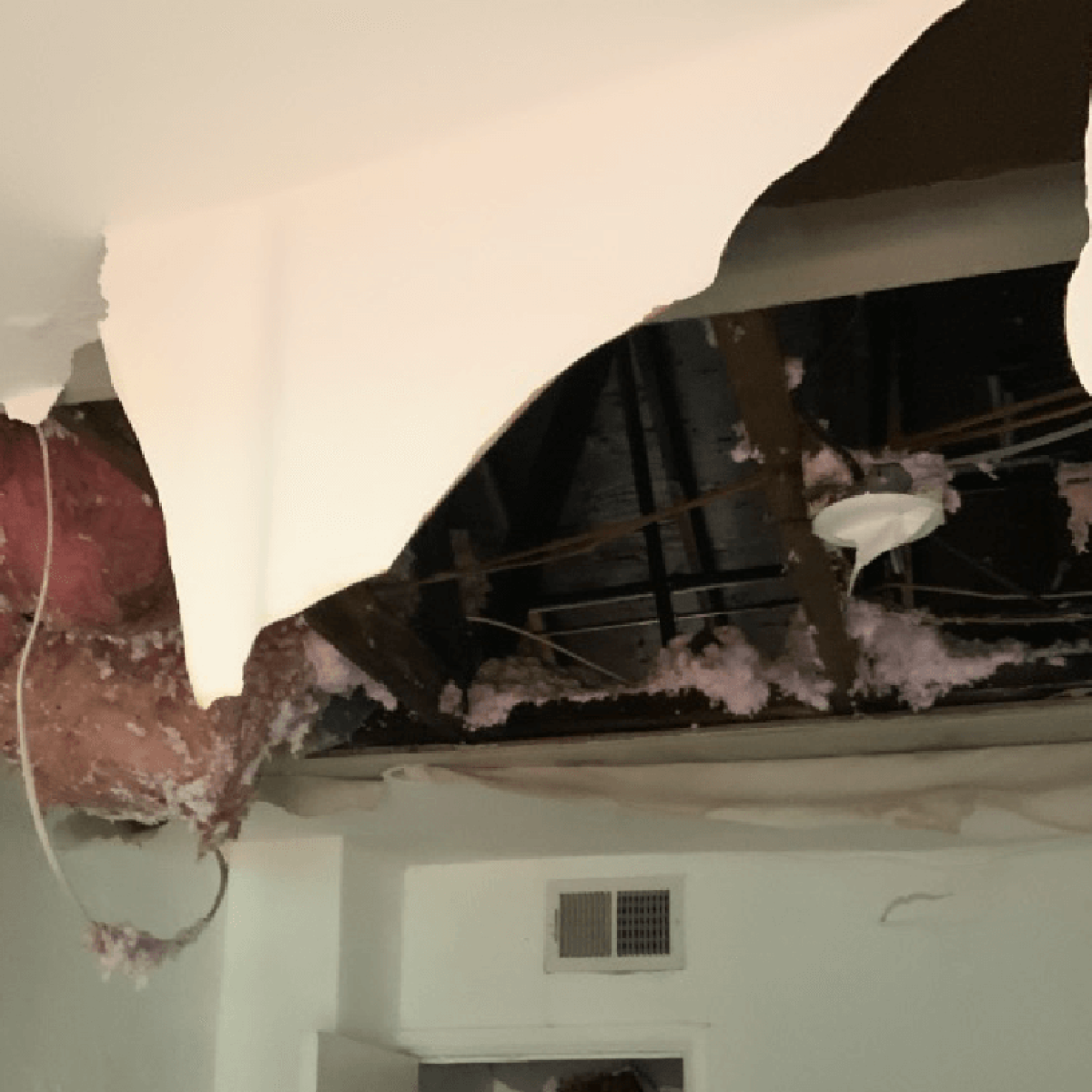 Ceiling and interior damage caused by a severe roof leak