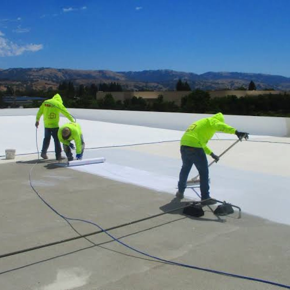 Commercial roof coating application on a flat roof in Palm Bay FL